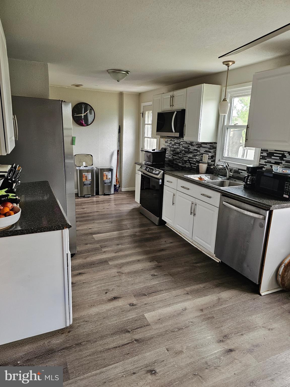 85 Hamilton Road Chambersburg, PA 17201 - Photo 3 of 13 a large kitchen with stainless steel appliances granite countertop a stove and a sink