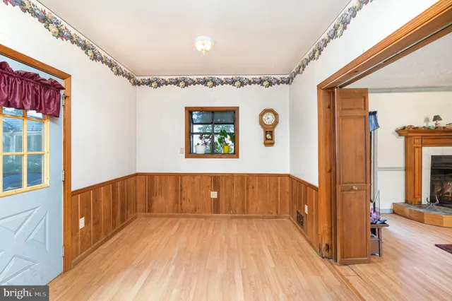 a view of hallway with wooden floor