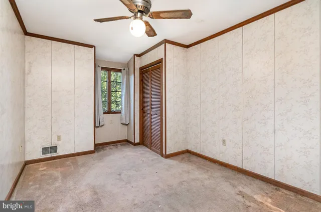 a front view of a house with a yard table and chairs