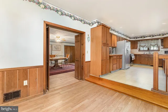 a view of a kitchen from the hallway