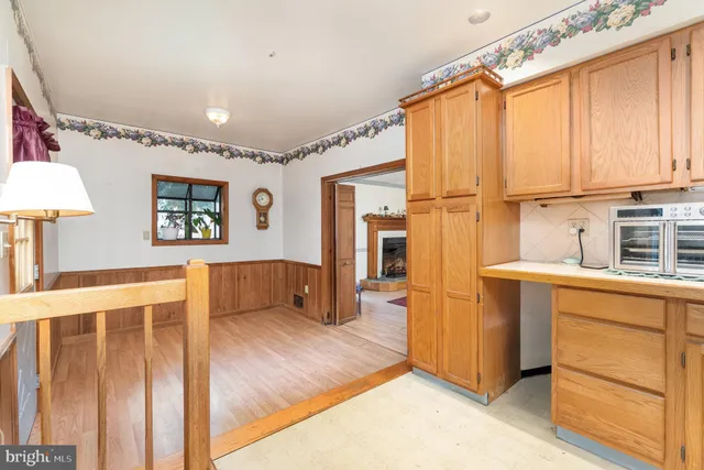 a kitchen with stainless steel appliances granite countertop a refrigerator sink and cabinets