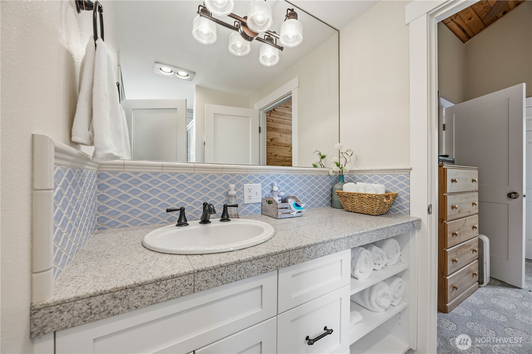 141 Sunset Place Manson, WA 98831 - Photo 27 of 38 a bathroom with a sink double vanity and a mirror