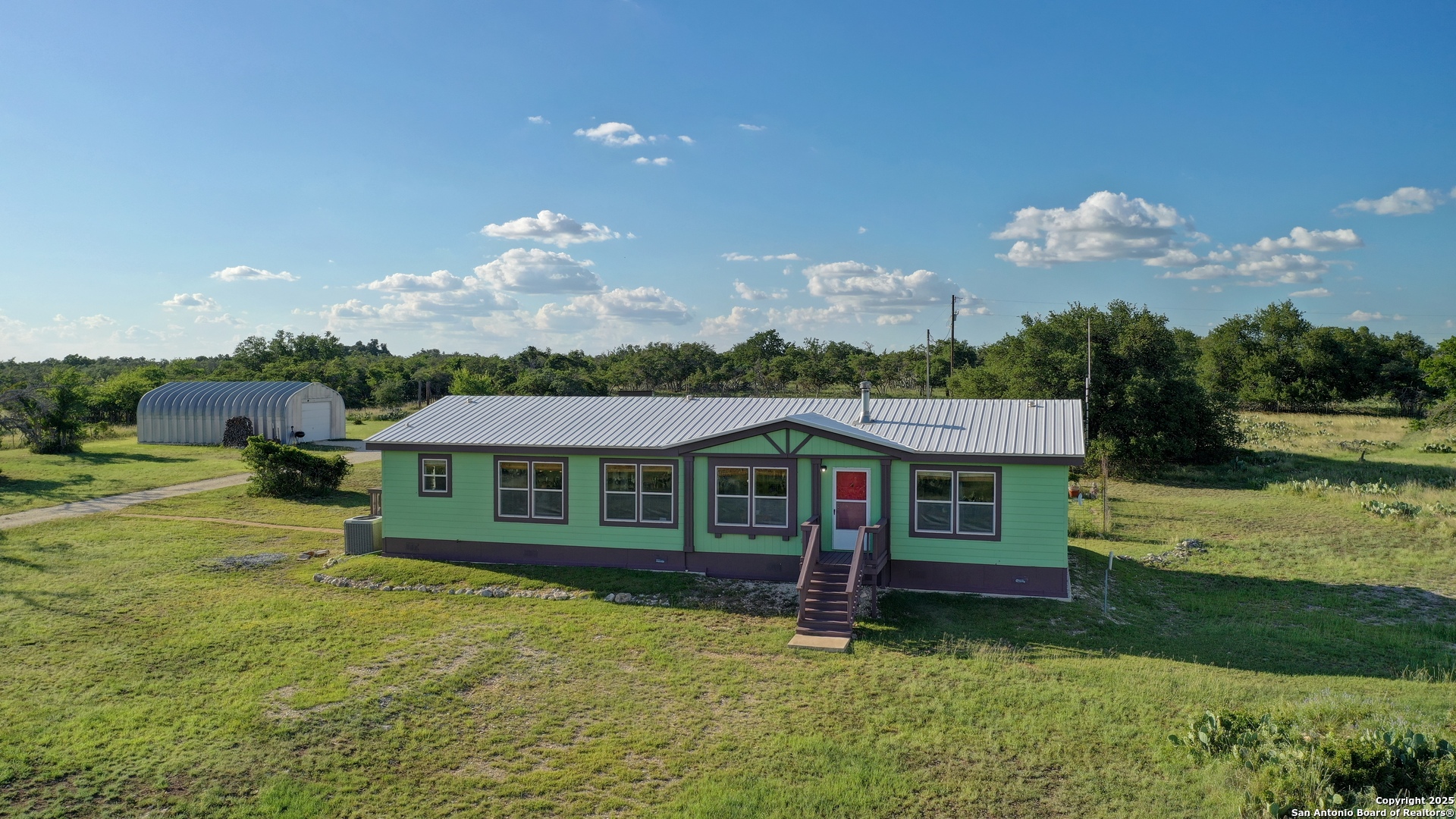 209 Esquell Ranch Road Northwest Harper, TX 78631 - Photo 1 of 1 a view of a house with a garden