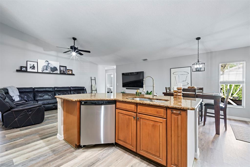 5133 Northwest 47th Avenue Coconut Creek, FL 33073 - Photo 12 of 44 a kitchen with stainless steel appliances a stove top oven and a refrigerator