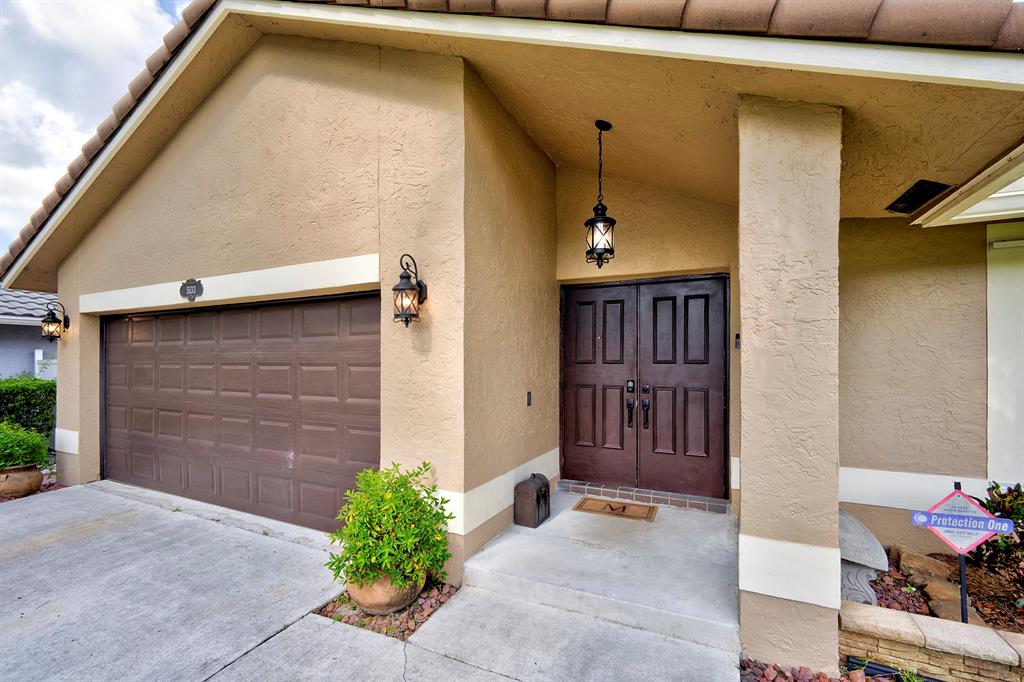 5133 Northwest 47th Avenue Coconut Creek, FL 33073 - Photo 3 of 44 a view of outdoor space and porch