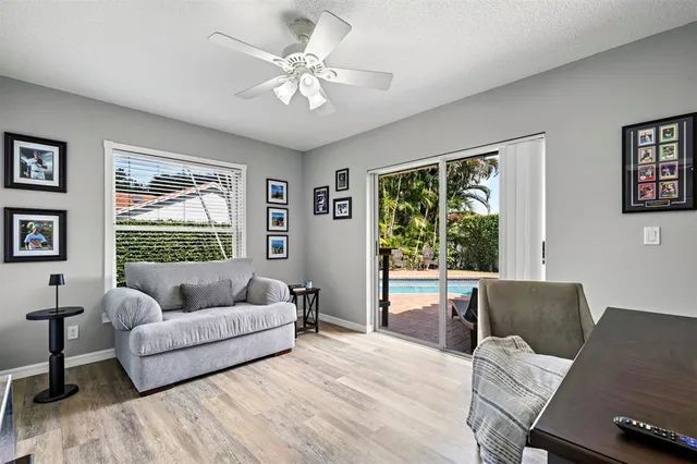 a view of a livingroom with furniture and a flat screen tv