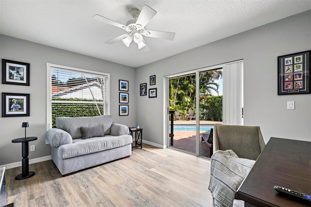 5133 Northwest 47th Avenue Coconut Creek, FL 33073 - Photo 32 of 44 a living room with furniture and a large window