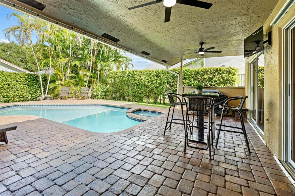 5133 Northwest 47th Avenue Coconut Creek, FL 33073 - Photo 35 of 44 an outdoor view of garden with patio