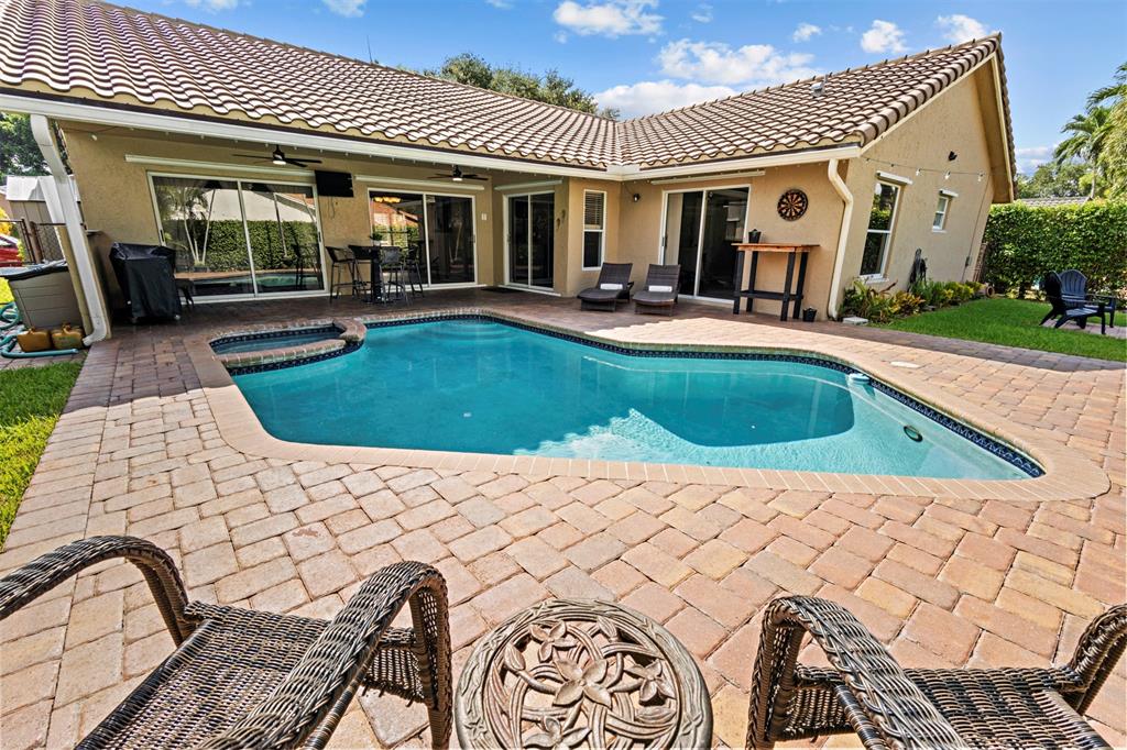 5133 Northwest 47th Avenue Coconut Creek, FL 33073 - Photo 37 of 44 a view of a house with a patio