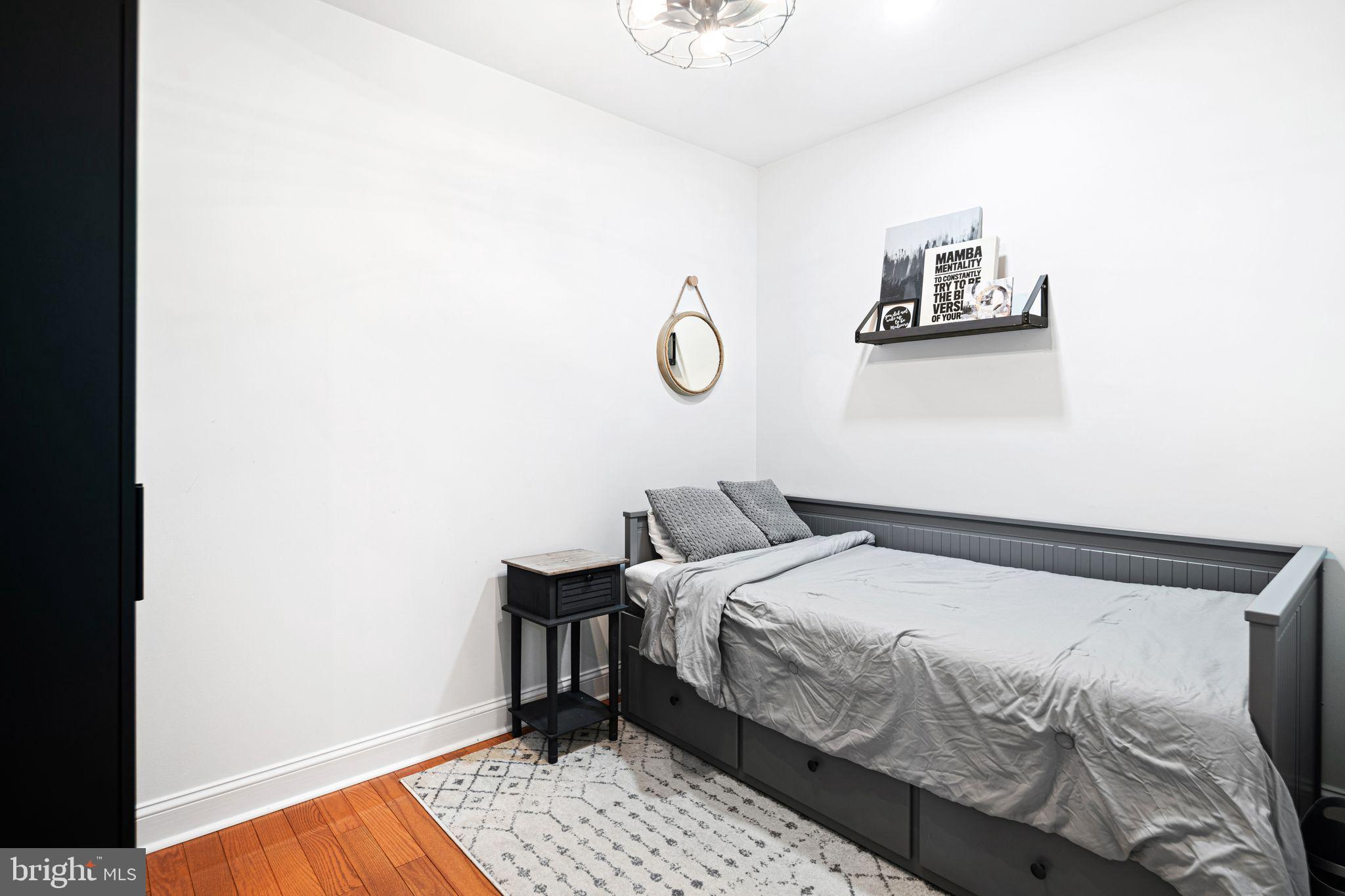 30 Kings Court, Unit 307 Haddonfield, NJ 08033 - Photo 13 of 15 a bedroom with a bed and a lamp
