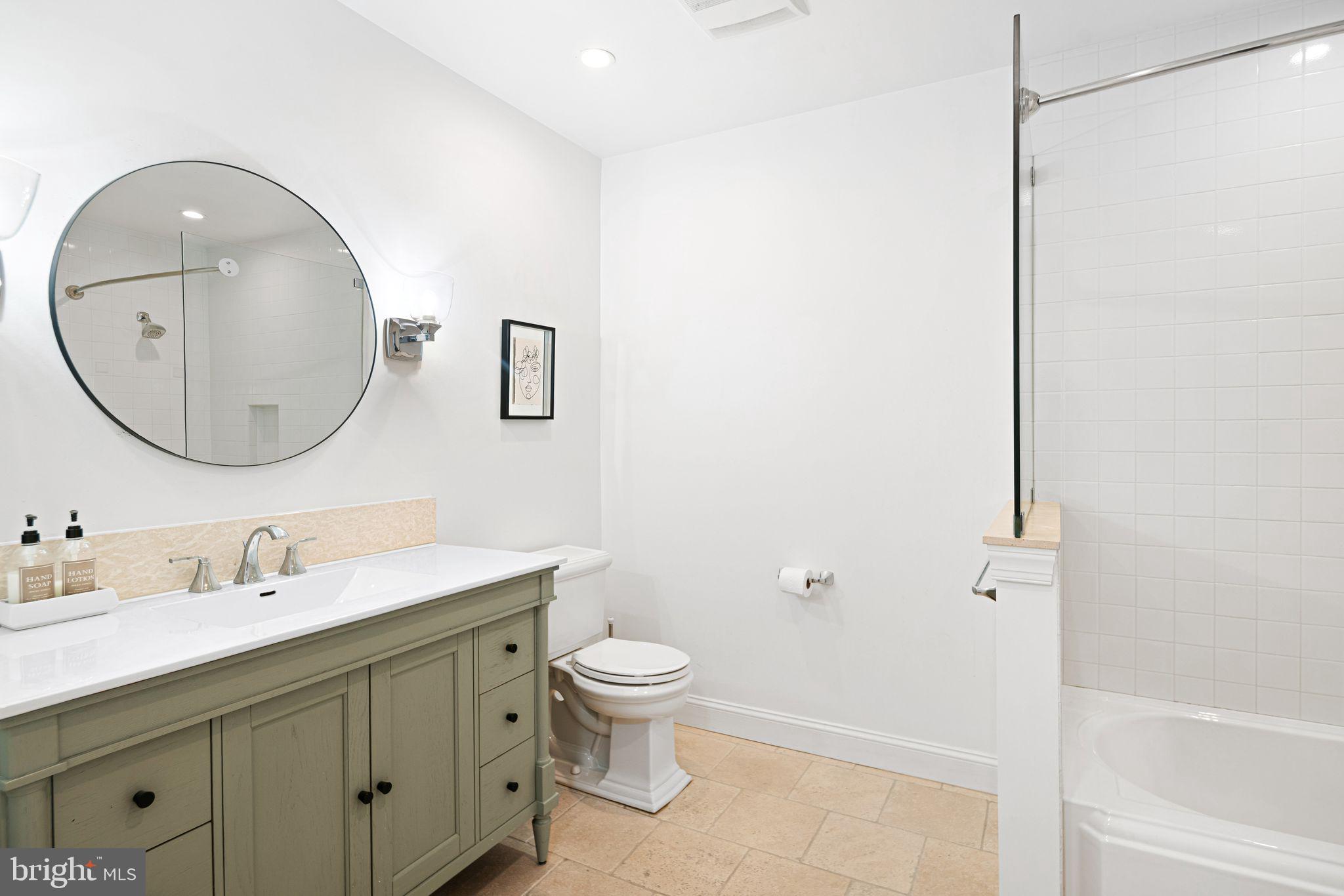 30 Kings Court, Unit 307 Haddonfield, NJ 08033 - Photo 14 of 15 a bathroom with a toilet sink and mirror