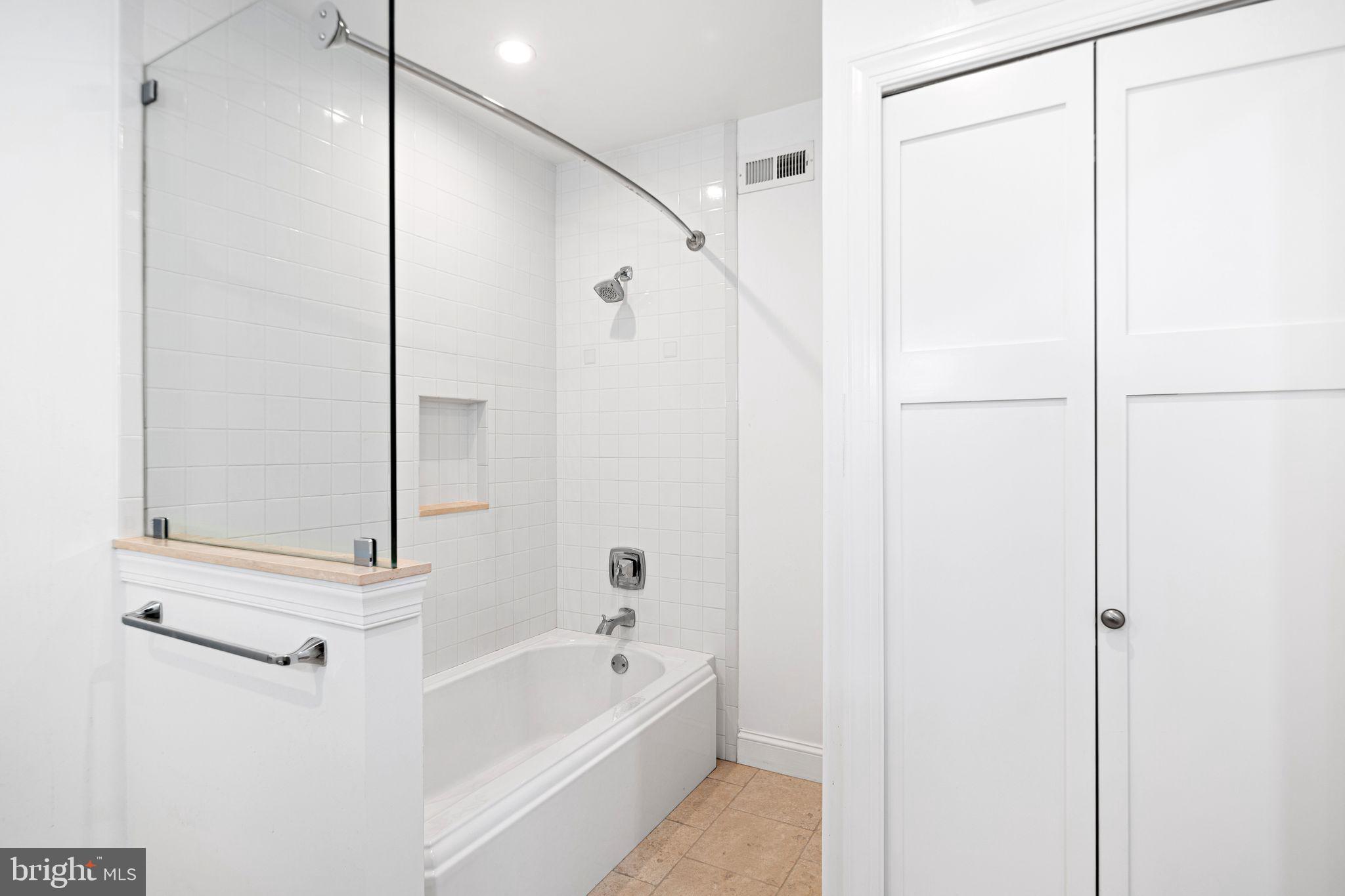 30 Kings Court, Unit 307 Haddonfield, NJ 08033 - Photo 15 of 15 a bathroom with a tub shower and sink