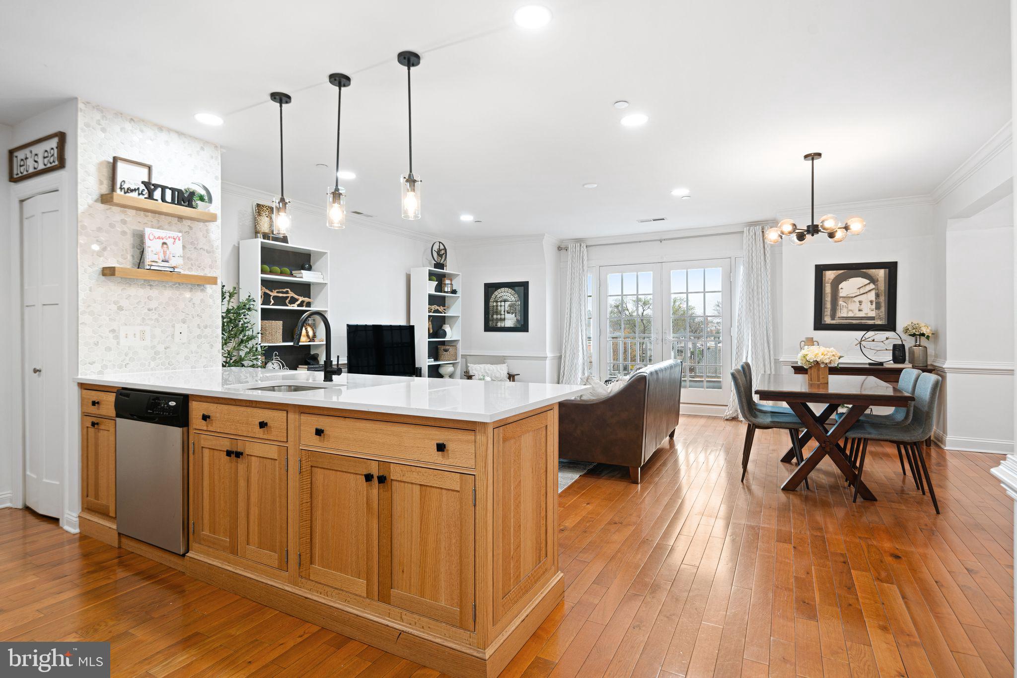 30 Kings Court, Unit 307 Haddonfield, NJ 08033 - Photo 2 of 15 a large kitchen with kitchen island a large island in it
