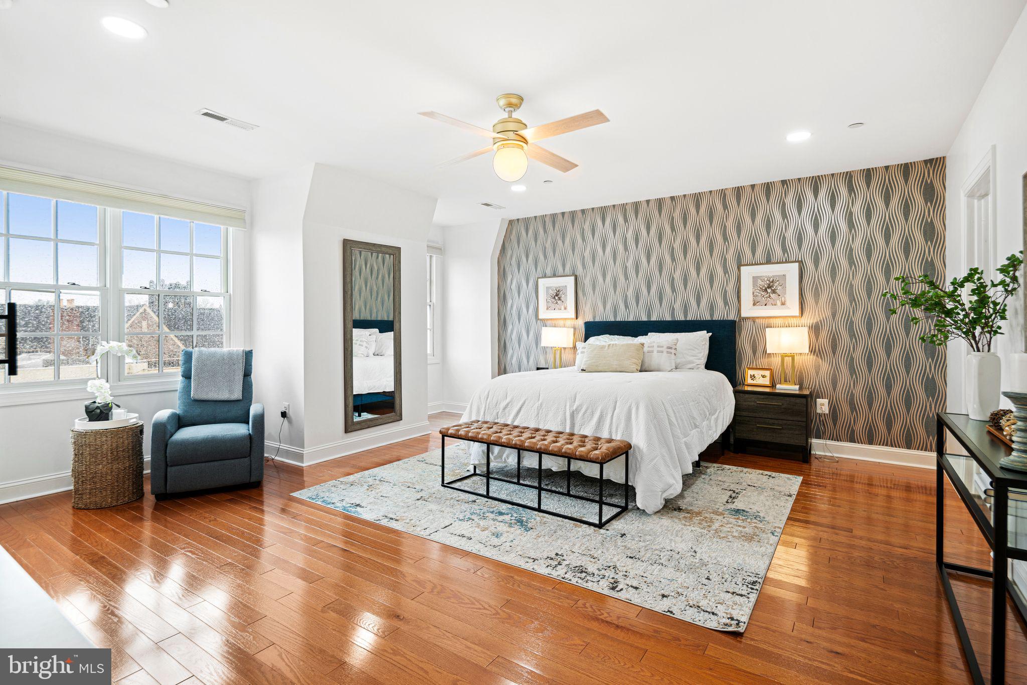 30 Kings Court, Unit 307 Haddonfield, NJ 08033 - Photo 7 of 15 a bedroom with a large bed and a couch