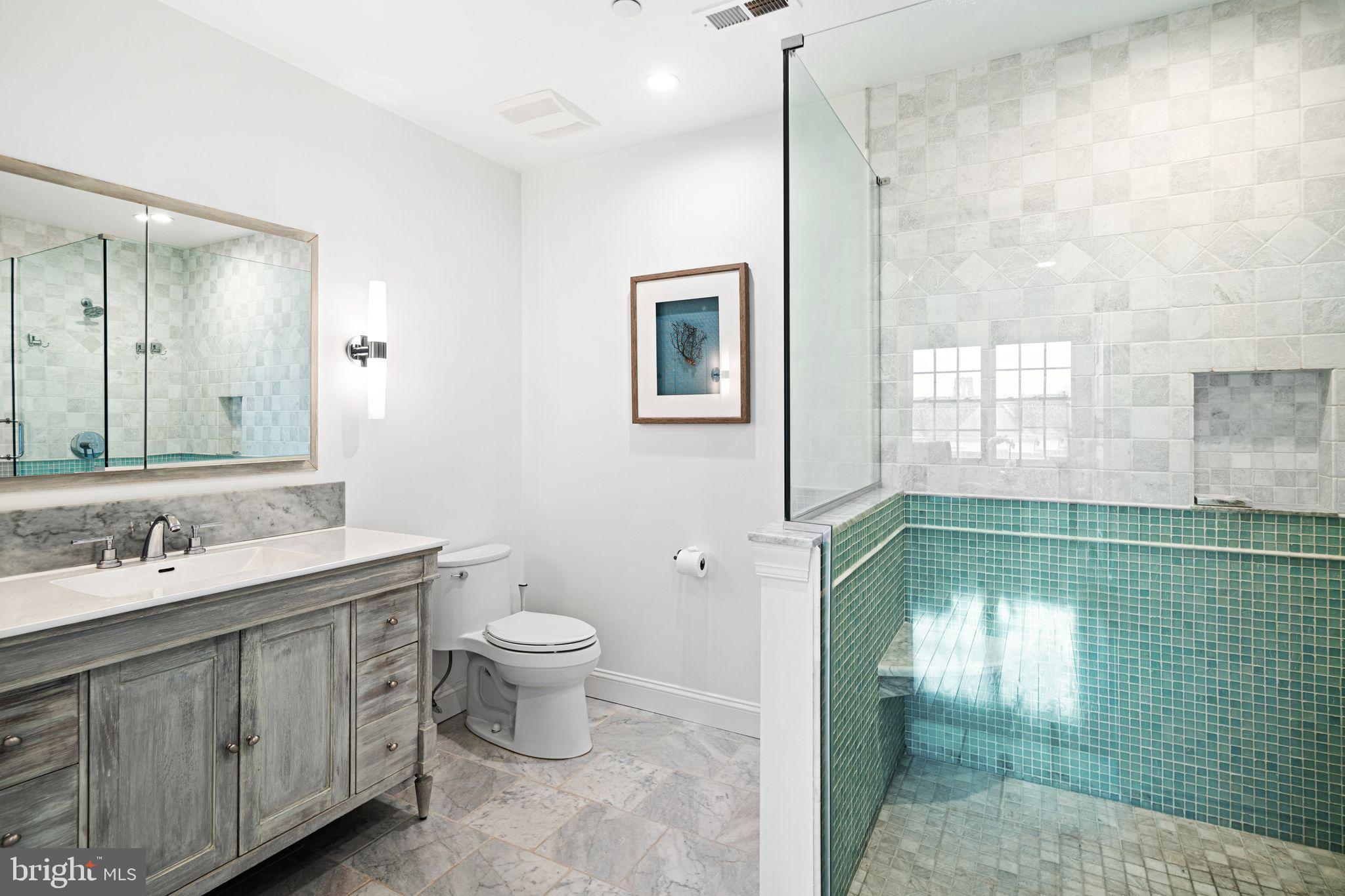 30 Kings Court, Unit 307 Haddonfield, NJ 08033 - Photo 10 of 15 a bathroom with a toilet sink and mirror