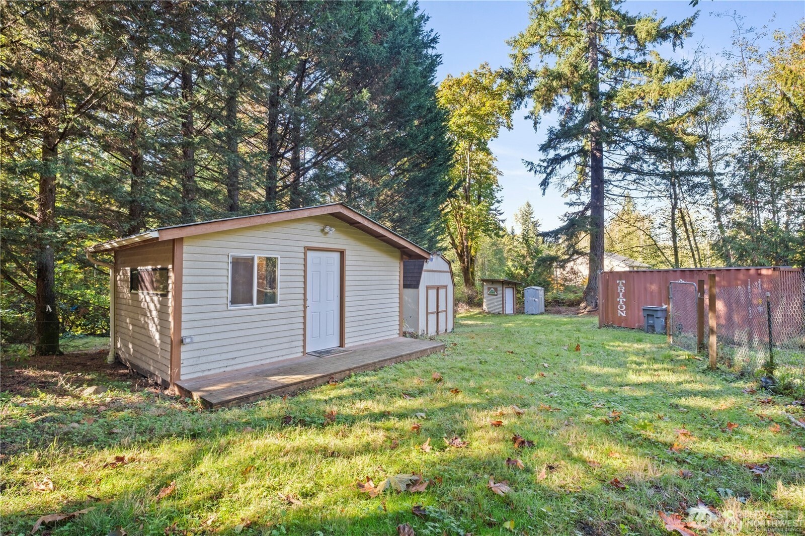 14310 200th Avenue Southeast Renton, WA 98058 - Photo 34 of 39 a view of a backyard with a large tree