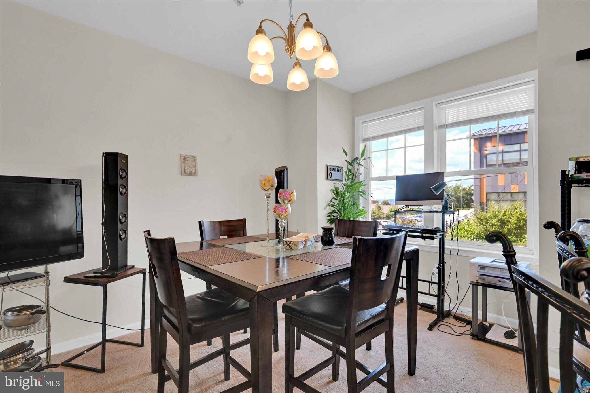 2380 Elvans Road Southeast Washington, DC 20020 - Photo 14 of 27 a view of a dining room with furniture and a flat screen tv