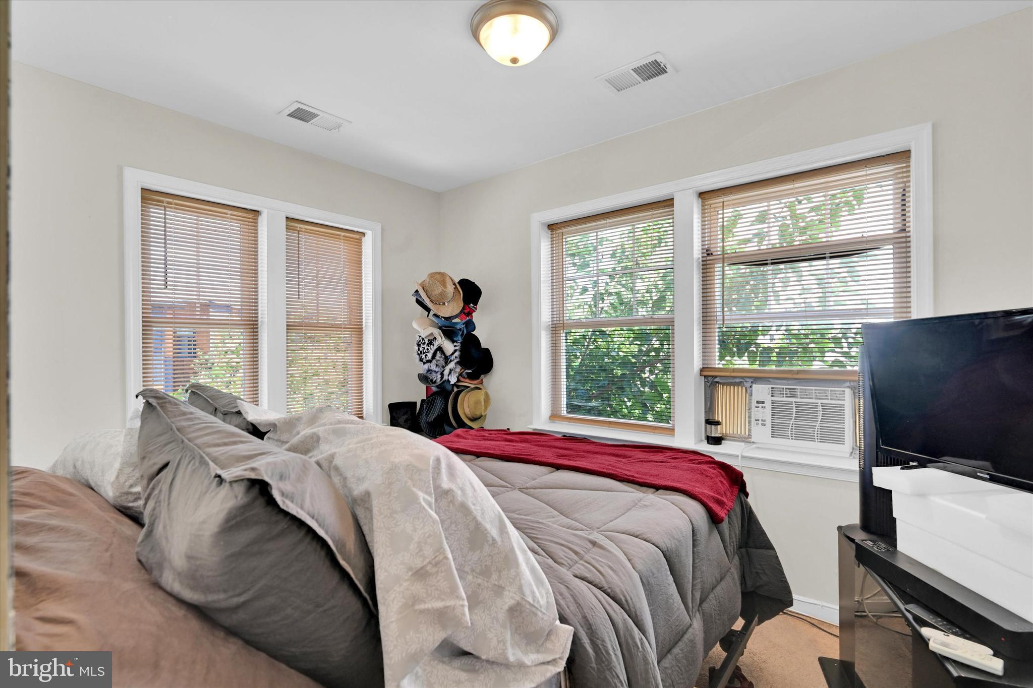 2380 Elvans Road Southeast Washington, DC 20020 - Photo 20 of 27 a bed sitting in a bedroom next to a window