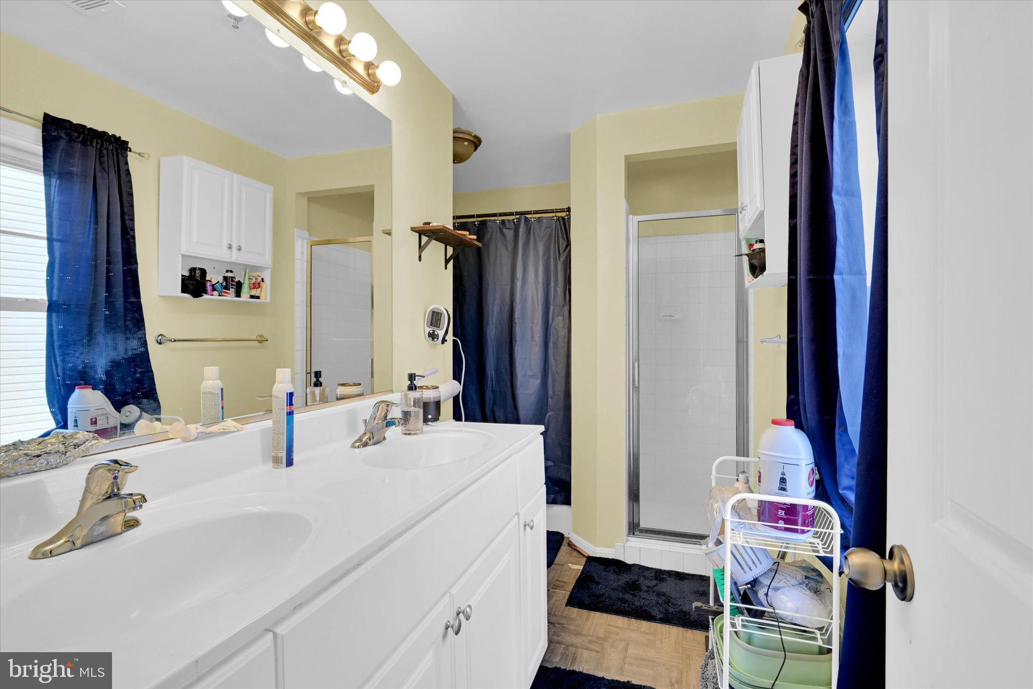 2380 Elvans Road Southeast Washington, DC 20020 - Photo 22 of 27 a en suite bathroom with a double vanity sink and a mirror