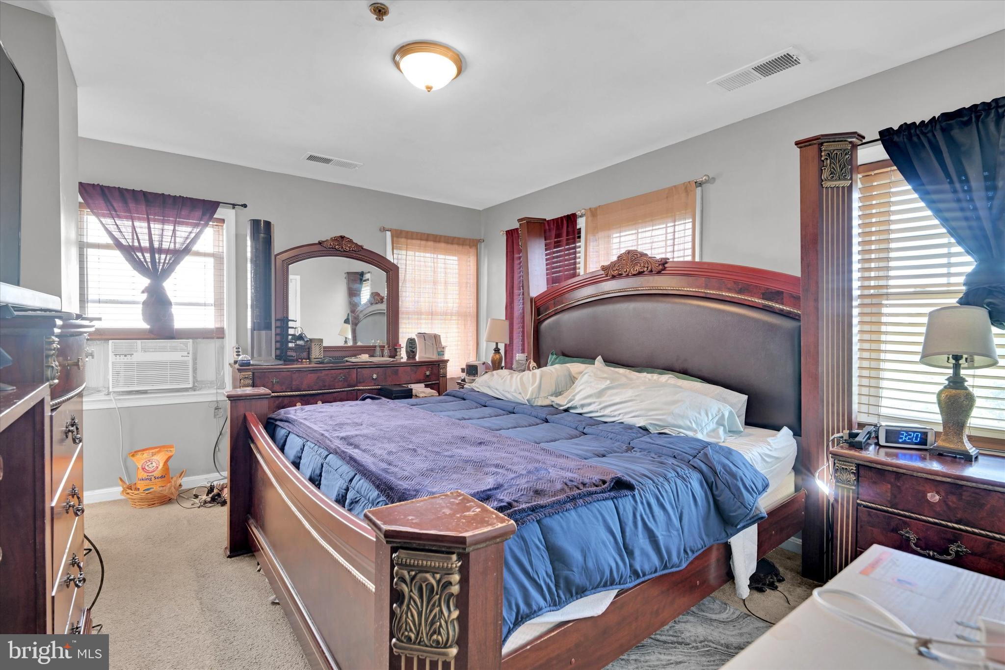 2380 Elvans Road Southeast Washington, DC 20020 - Photo 24 of 27 a bedroom with a bed and wooden floor