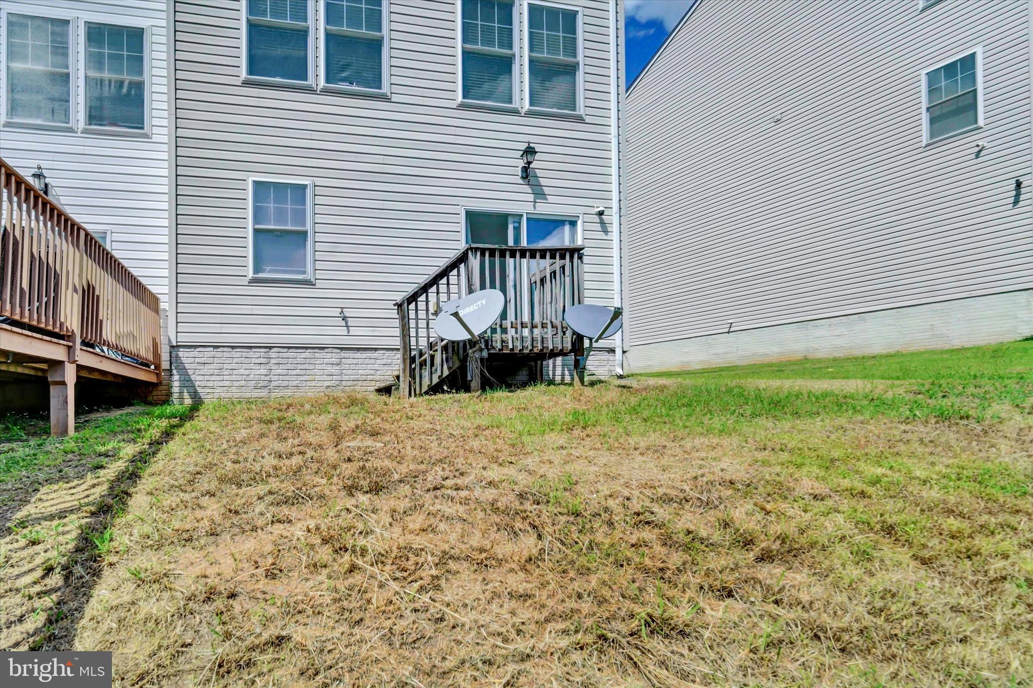2380 Elvans Road Southeast Washington, DC 20020 - Photo 26 of 27 a front view of a house with a garden and seating space