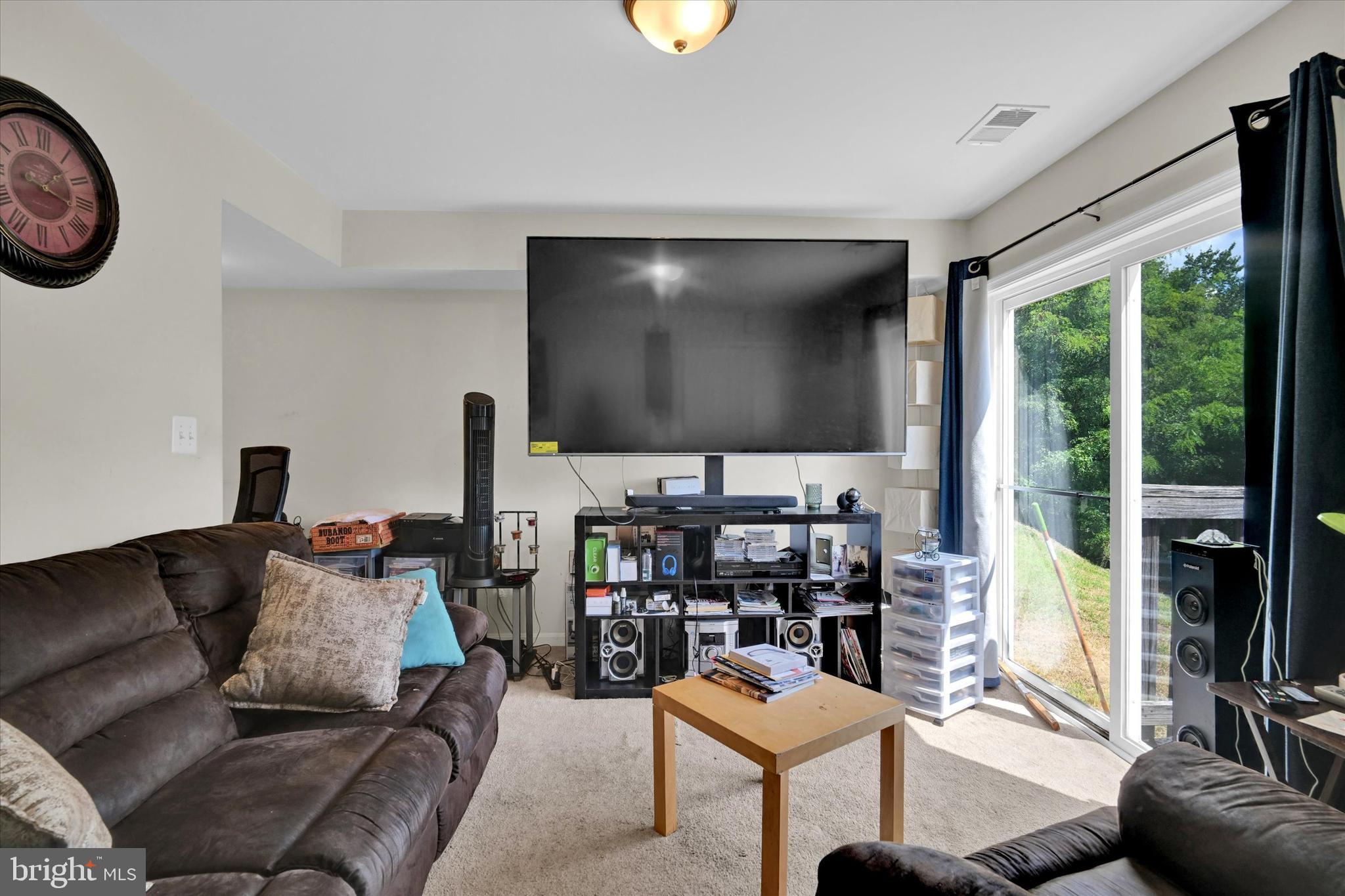 2380 Elvans Road Southeast Washington, DC 20020 - Photo 4 of 27 a living room with furniture and a flat screen tv