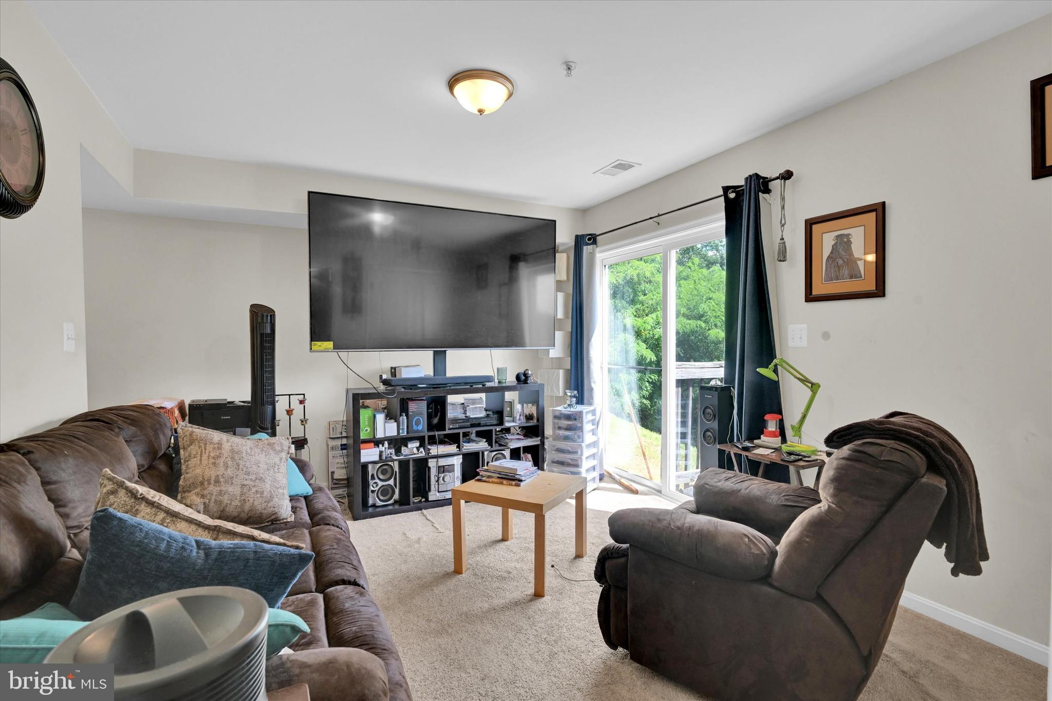 2380 Elvans Road Southeast Washington, DC 20020 - Photo 6 of 27 a living room with furniture and a flat screen tv