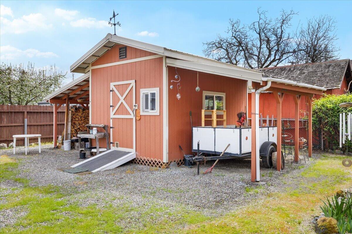 440 Bush Street Central Point, OR 97502 - Photo 30 of 40 a house view with a backyard space