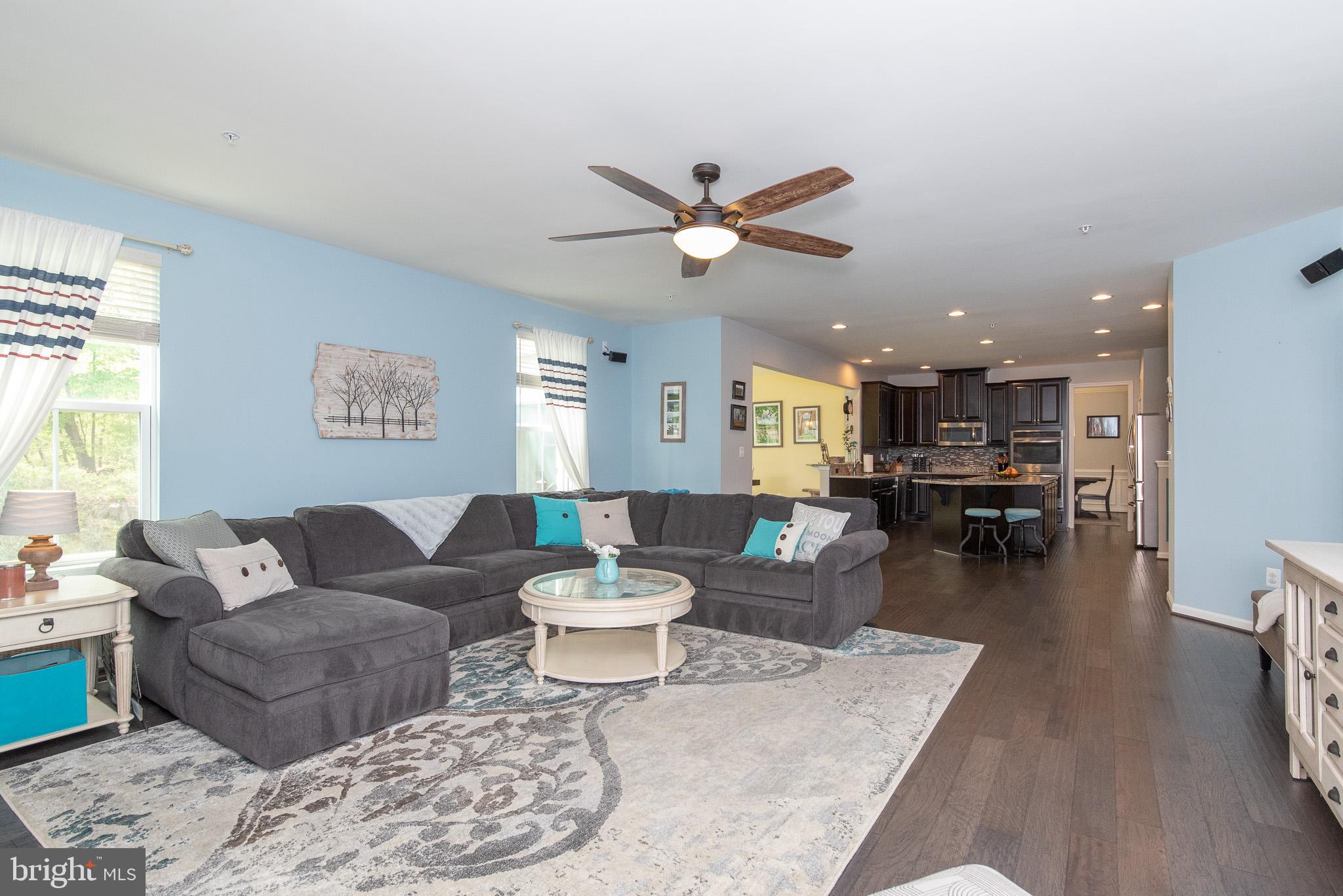 10426 Windlass Run Road Baltimore, MD 21220 - Photo 20 of 56 a living room with furniture and a view of kitchen