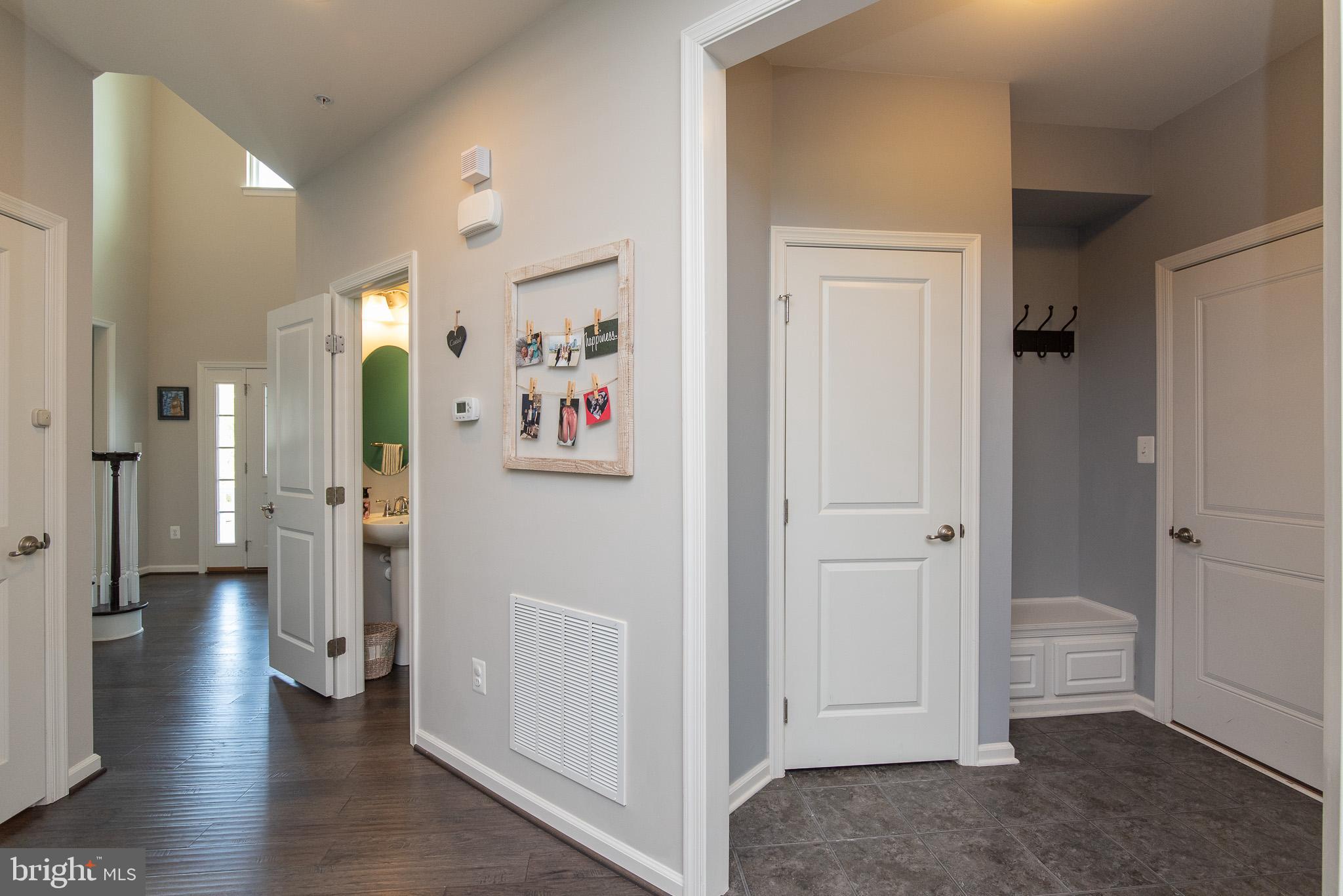 10426 Windlass Run Road Baltimore, MD 21220 - Photo 23 of 56 a view of a hallway with wooden floor and closet area