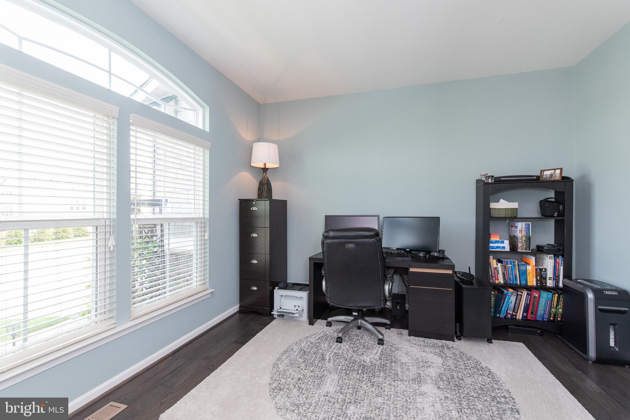 10426 Windlass Run Road Baltimore, MD 21220 - Photo 25 of 56 a view of a workspace with furniture and a window