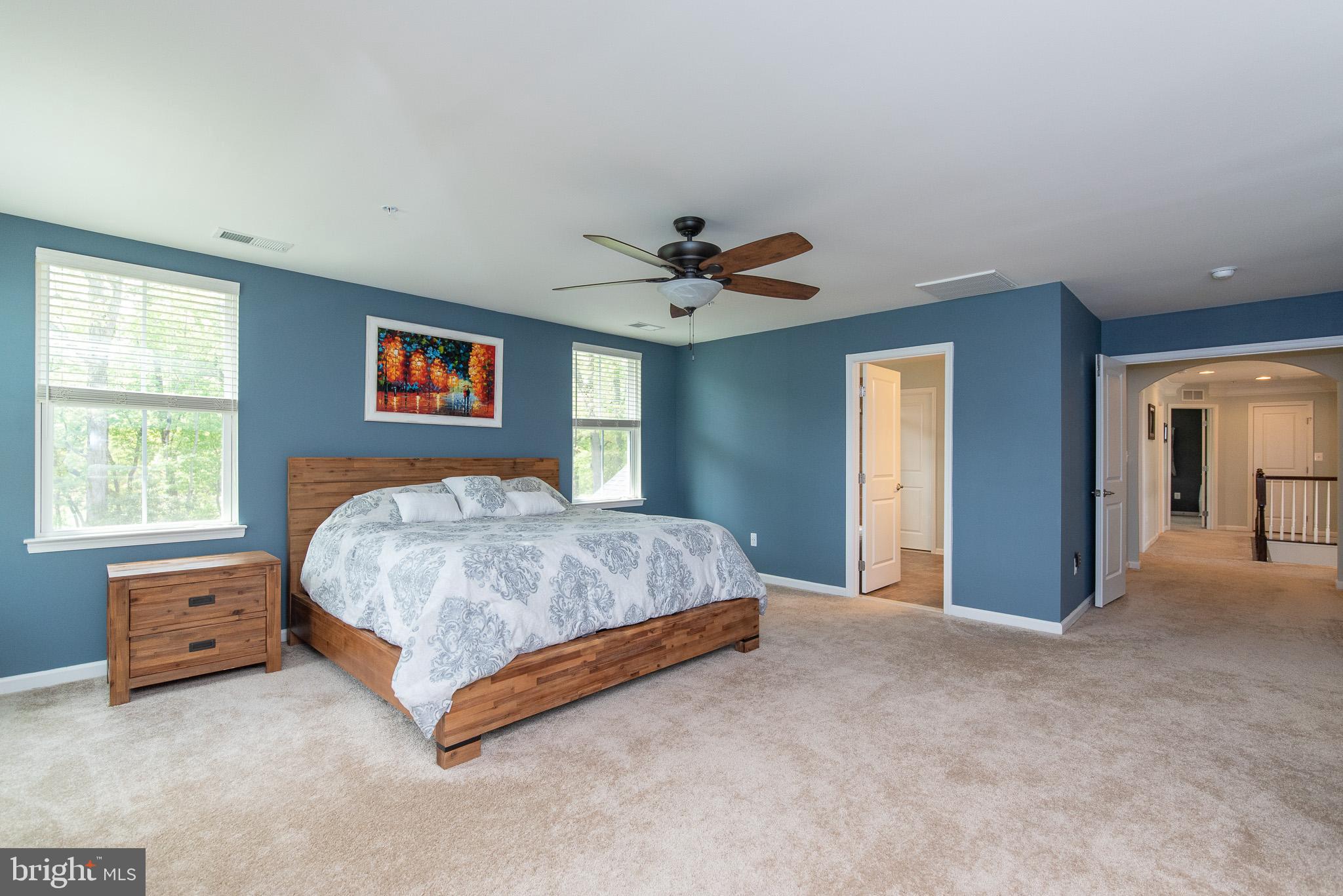 10426 Windlass Run Road Baltimore, MD 21220 - Photo 29 of 56 a spacious bedroom with a bed and a window