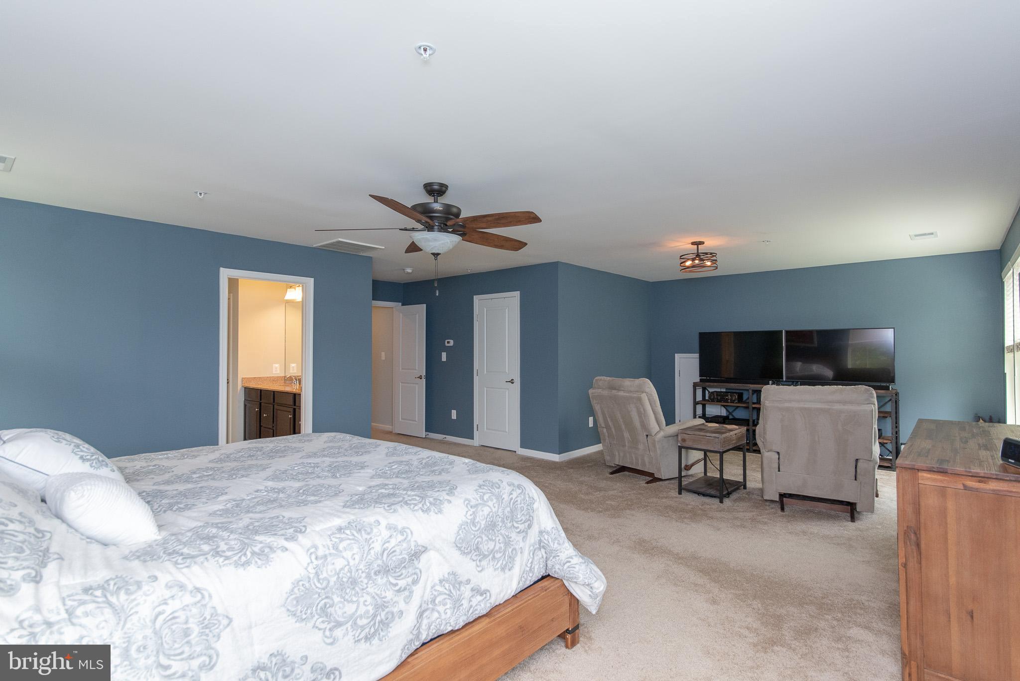 10426 Windlass Run Road Baltimore, MD 21220 - Photo 31 of 56 a bedroom with a bed and furniture