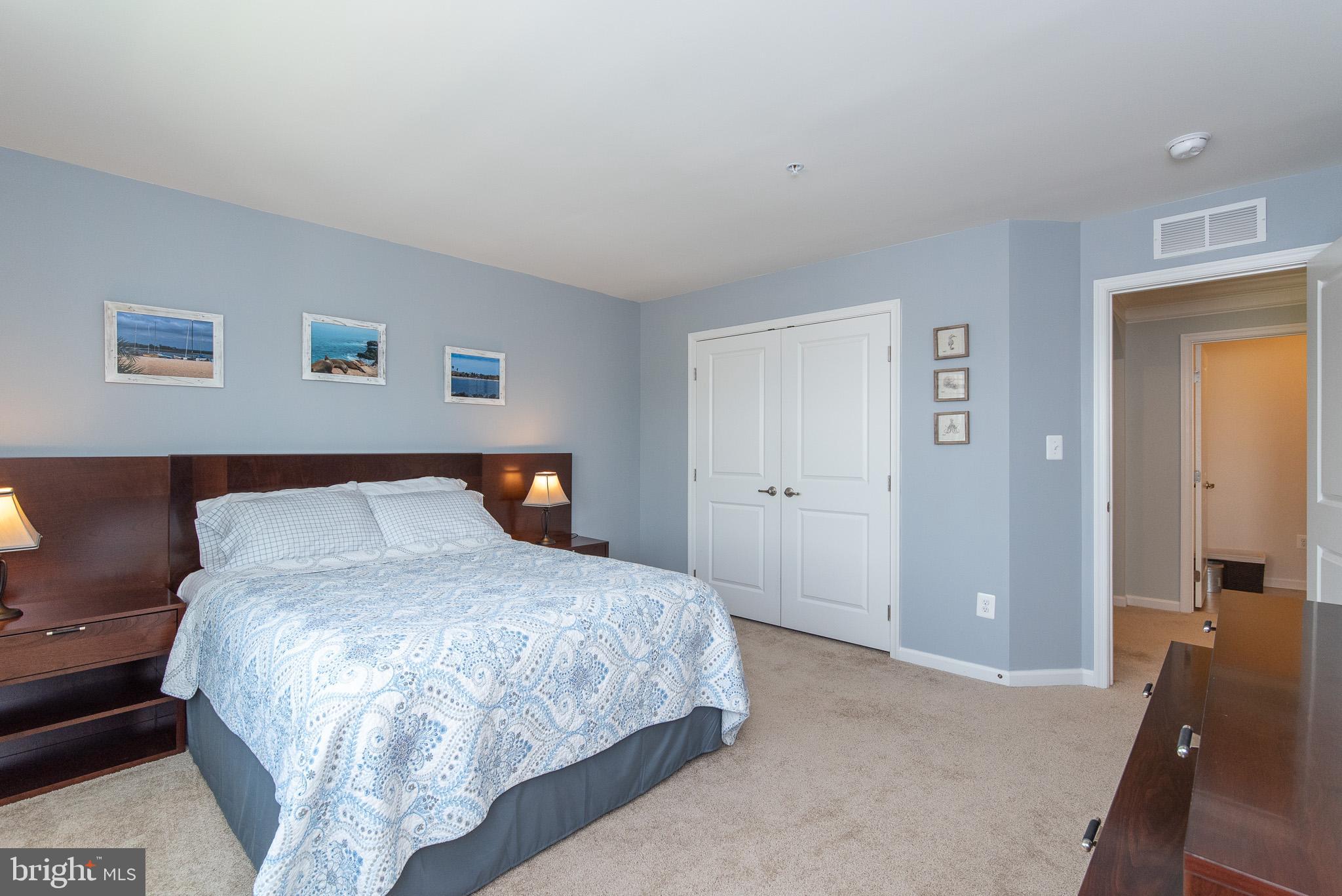 10426 Windlass Run Road Baltimore, MD 21220 - Photo 37 of 56 a large bed sitting in a bedroom and a lamp