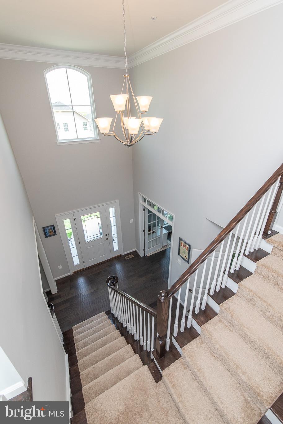 10426 Windlass Run Road Baltimore, MD 21220 - Photo 5 of 56 a view of entryway and hall with wooden floor
