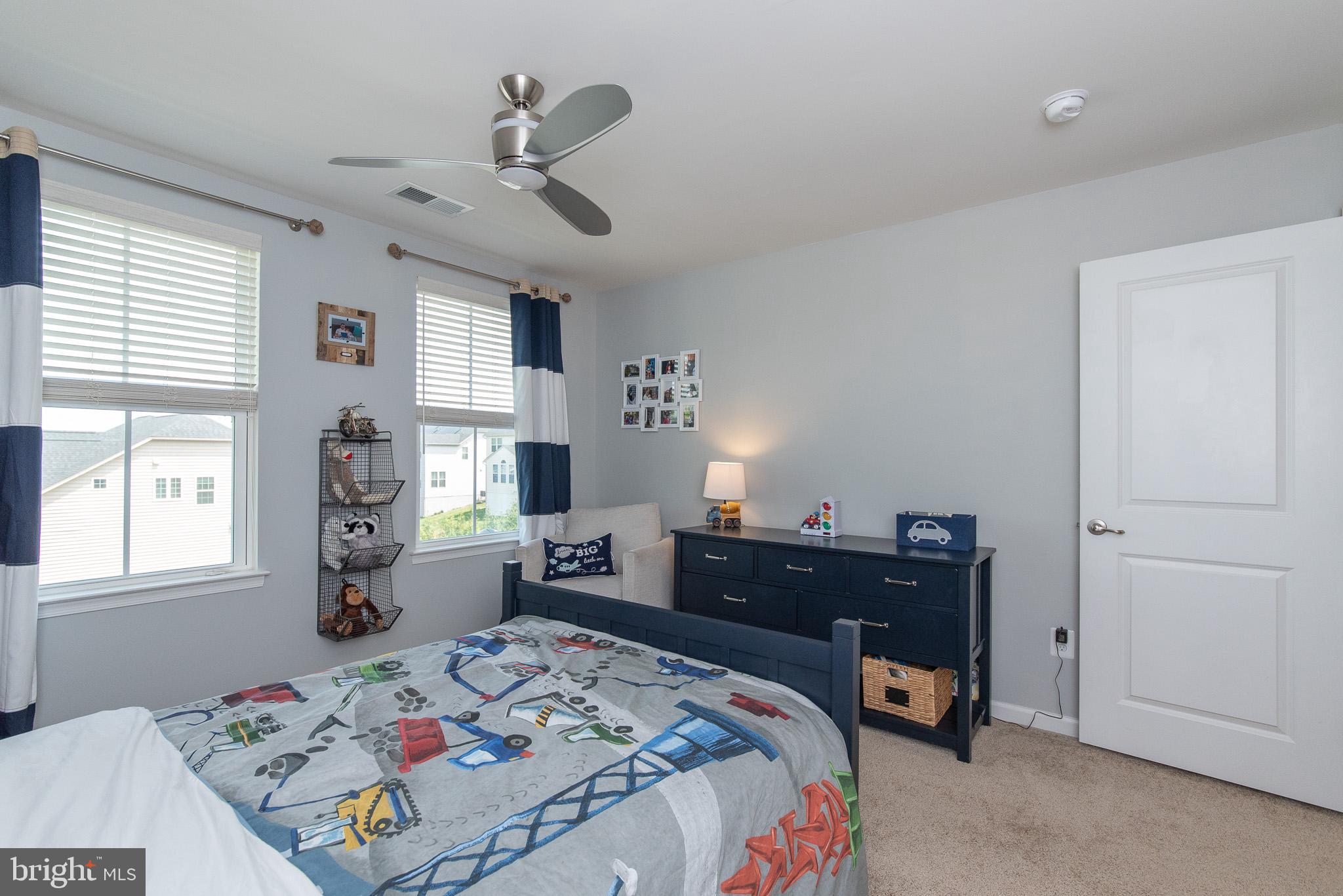 10426 Windlass Run Road Baltimore, MD 21220 - Photo 41 of 56 a bed room with a bed and a dresser