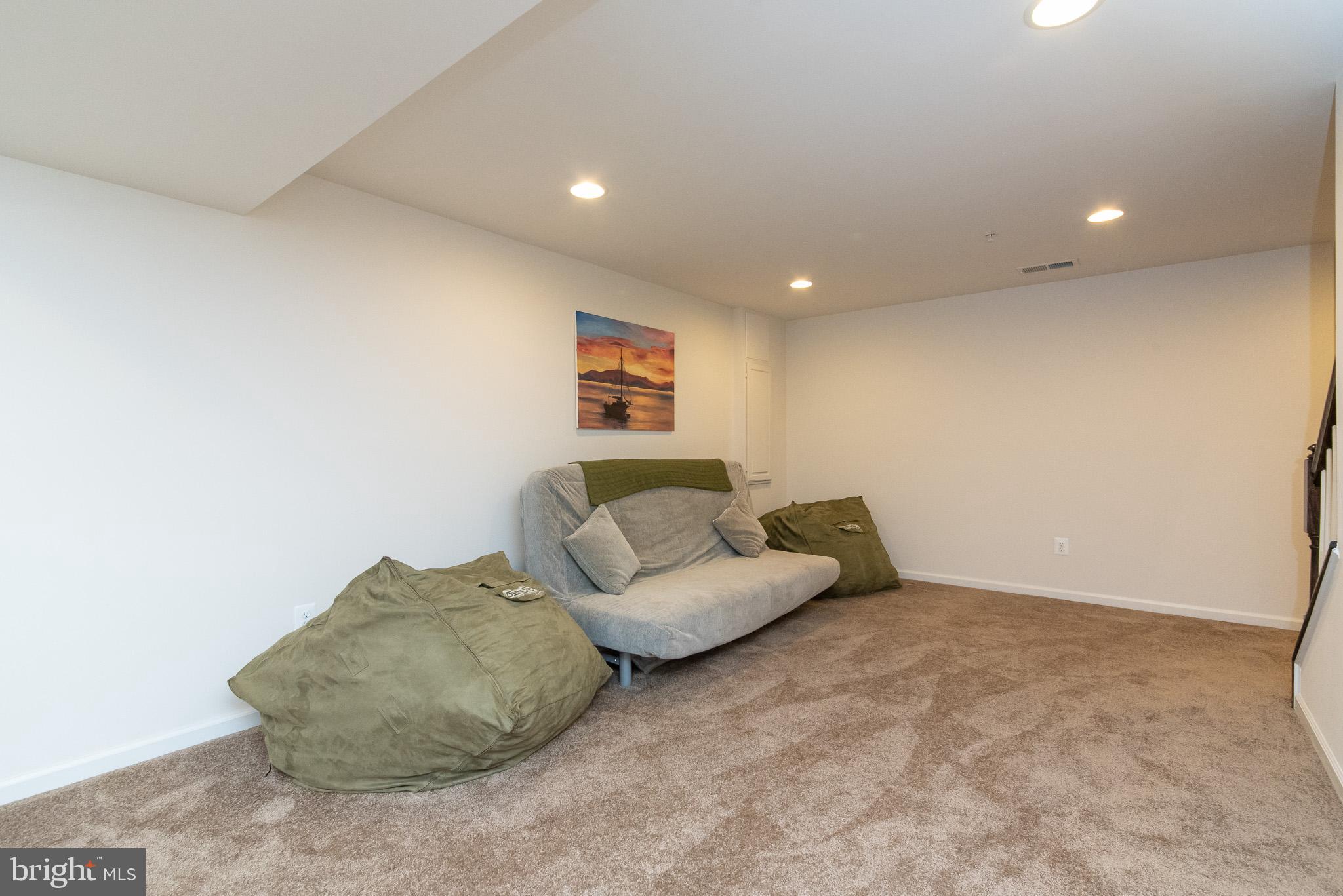 10426 Windlass Run Road Baltimore, MD 21220 - Photo 50 of 56 a living room with furniture and a couch