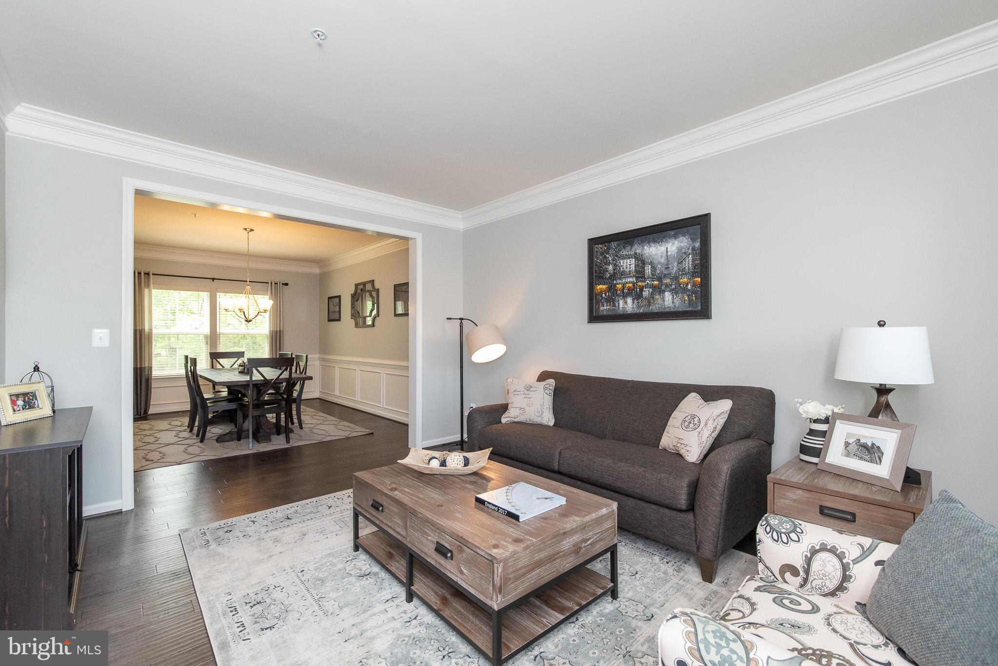 10426 Windlass Run Road Baltimore, MD 21220 - Photo 6 of 56 a living room with furniture and a table