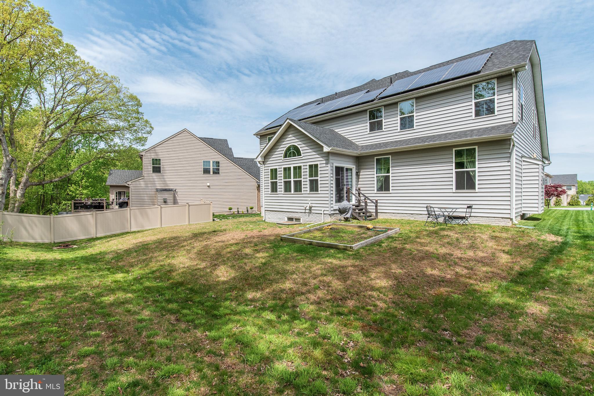 10426 Windlass Run Road Baltimore, MD 21220 - Photo 54 of 56 a front view of house with yard and green space
