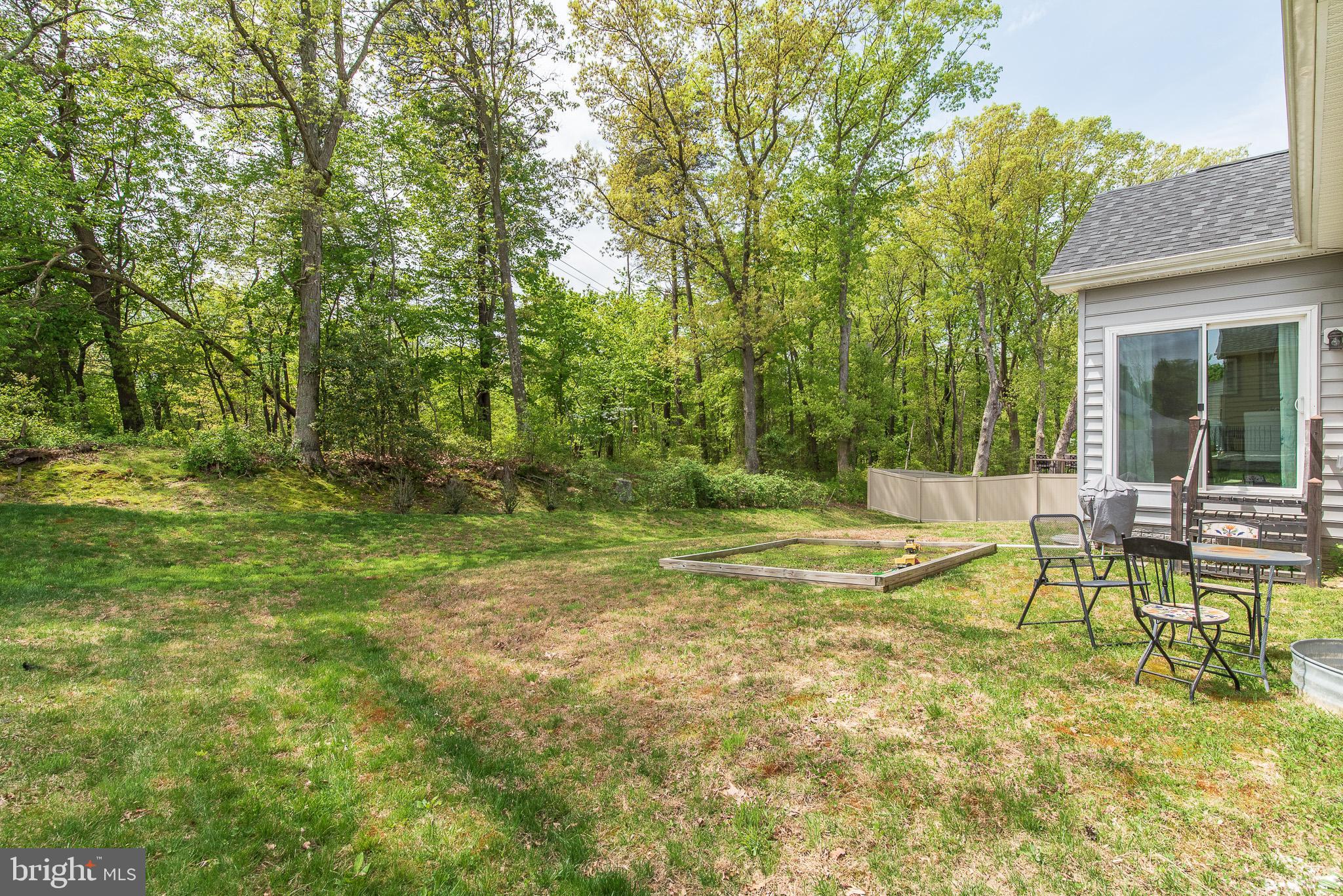 10426 Windlass Run Road Baltimore, MD 21220 - Photo 55 of 56 a view of swimming pool with lawn chairs and large trees