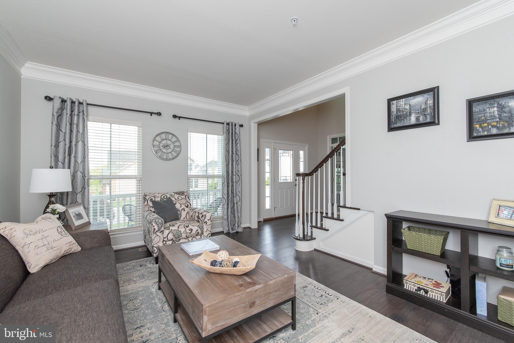 10426 Windlass Run Road Baltimore, MD 21220 - Photo 7 of 56 a living room with furniture and a window