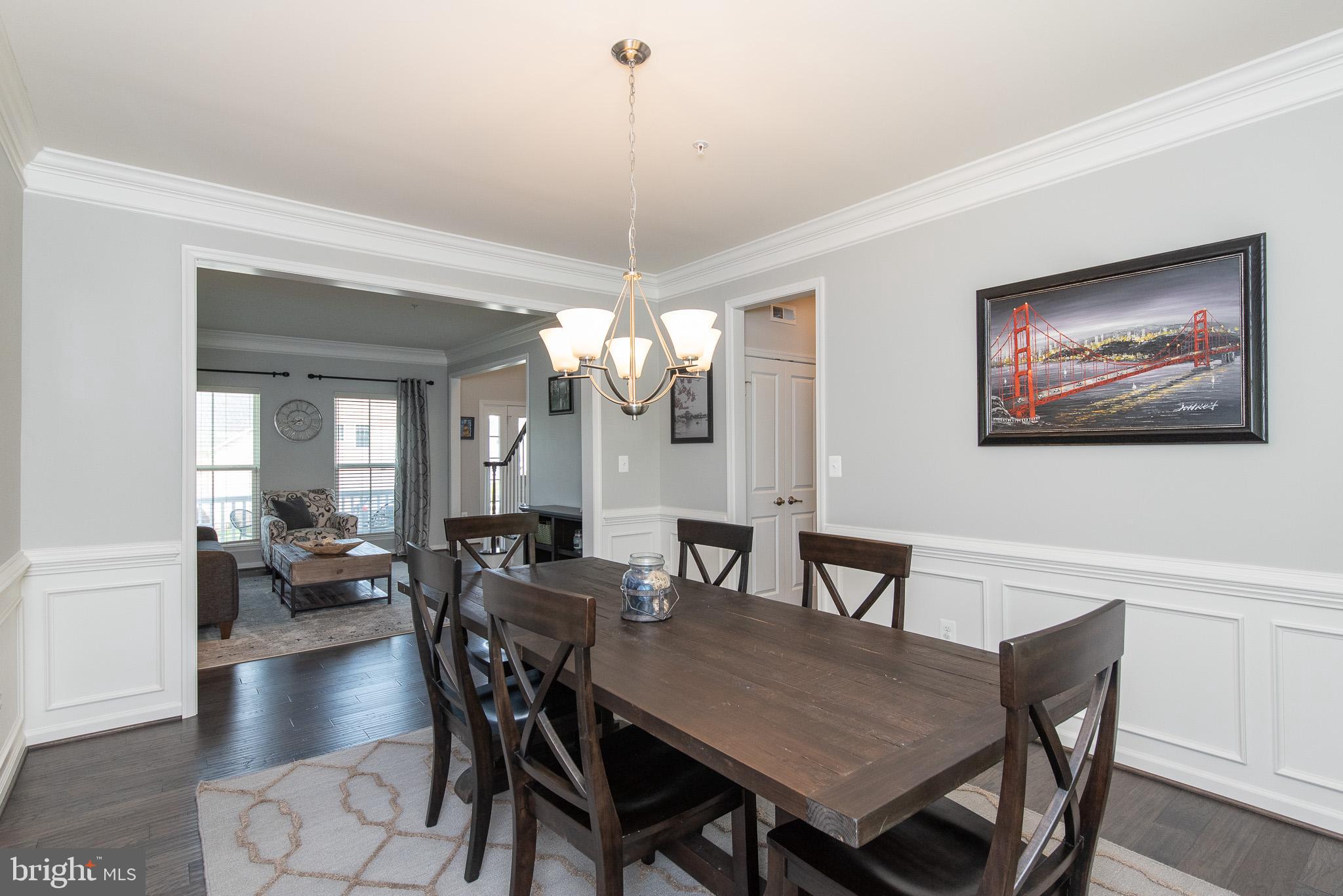 10426 Windlass Run Road Baltimore, MD 21220 - Photo 10 of 56 a view of a dining room with furniture window and wooden floor