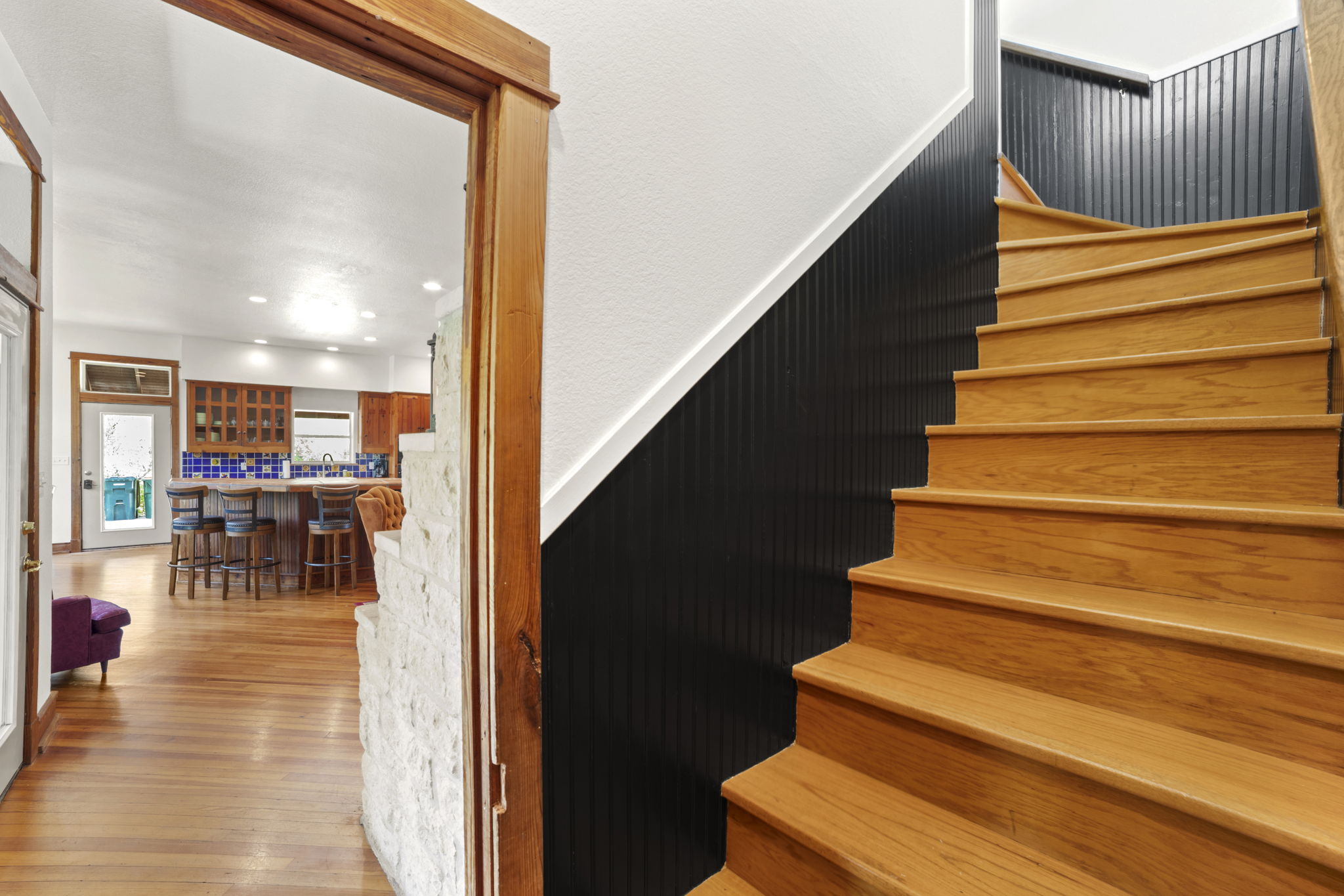 20001 Hamilton Pool Road Dripping Springs, TX 78620 - Photo 17 of 40 Stairwell looking into living room/kitchen