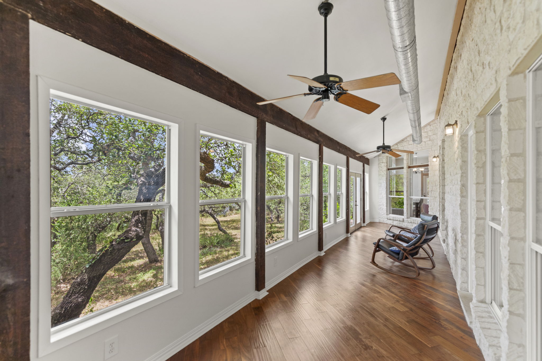 20001 Hamilton Pool Road Dripping Springs, TX 78620 - Photo 23 of 40 Air-conditioned 'Sun Room' with fans.