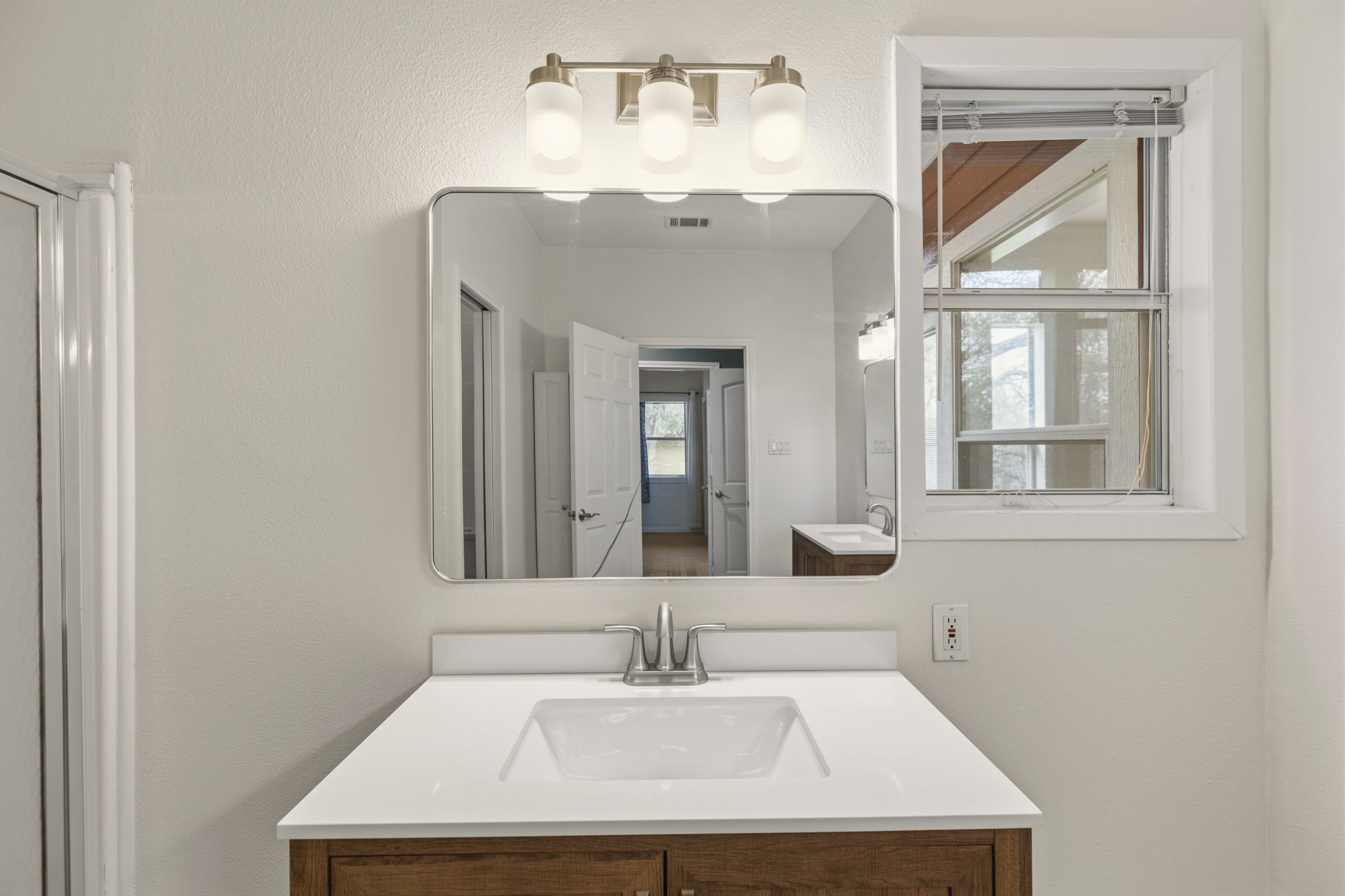 20001 Hamilton Pool Road Dripping Springs, TX 78620 - Photo 27 of 40 Recently updated with new flooring, vanities, mirrors, and light fixtures.