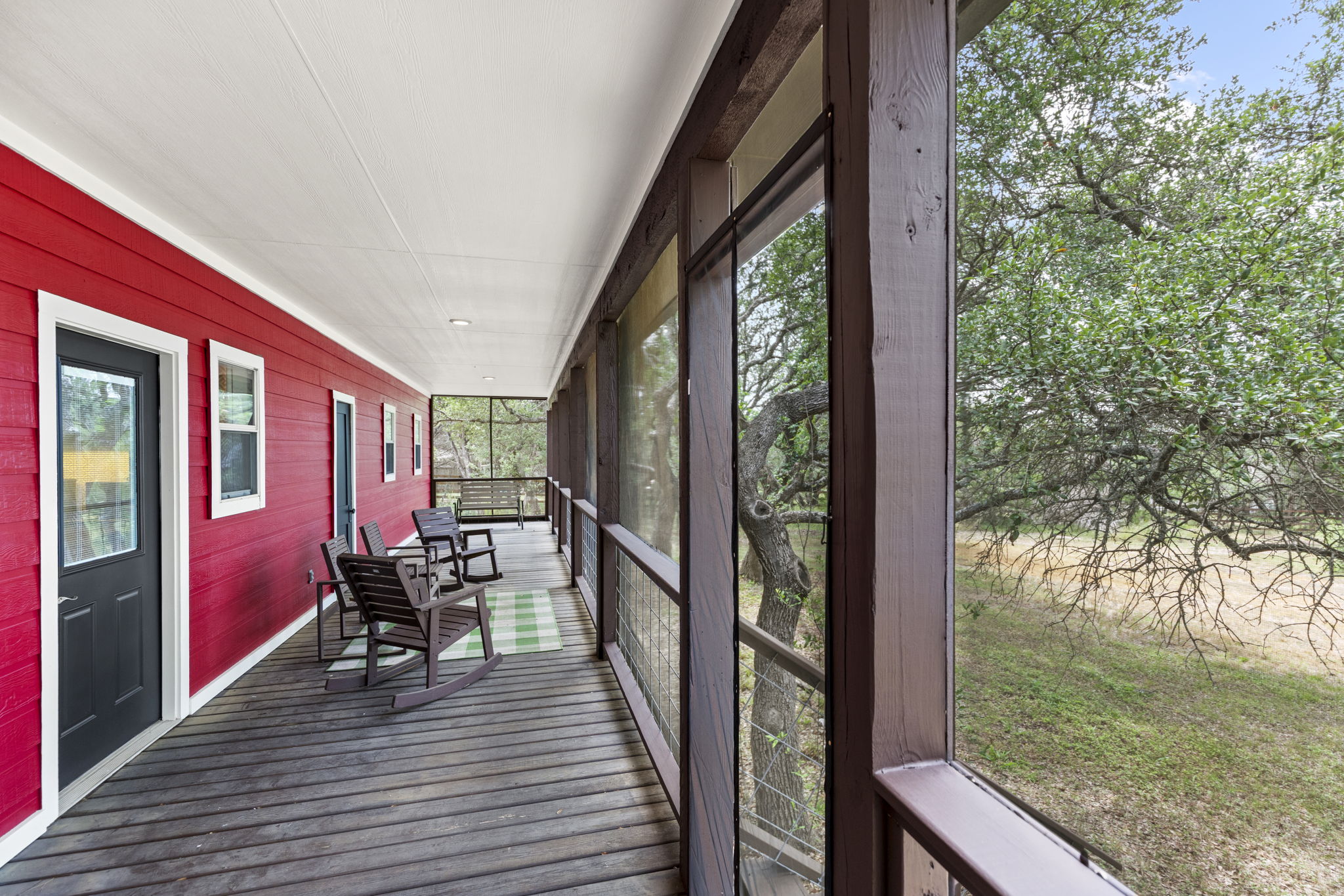 20001 Hamilton Pool Road Dripping Springs, TX 78620 - Photo 33 of 40 Screened porch on the backside of the house.