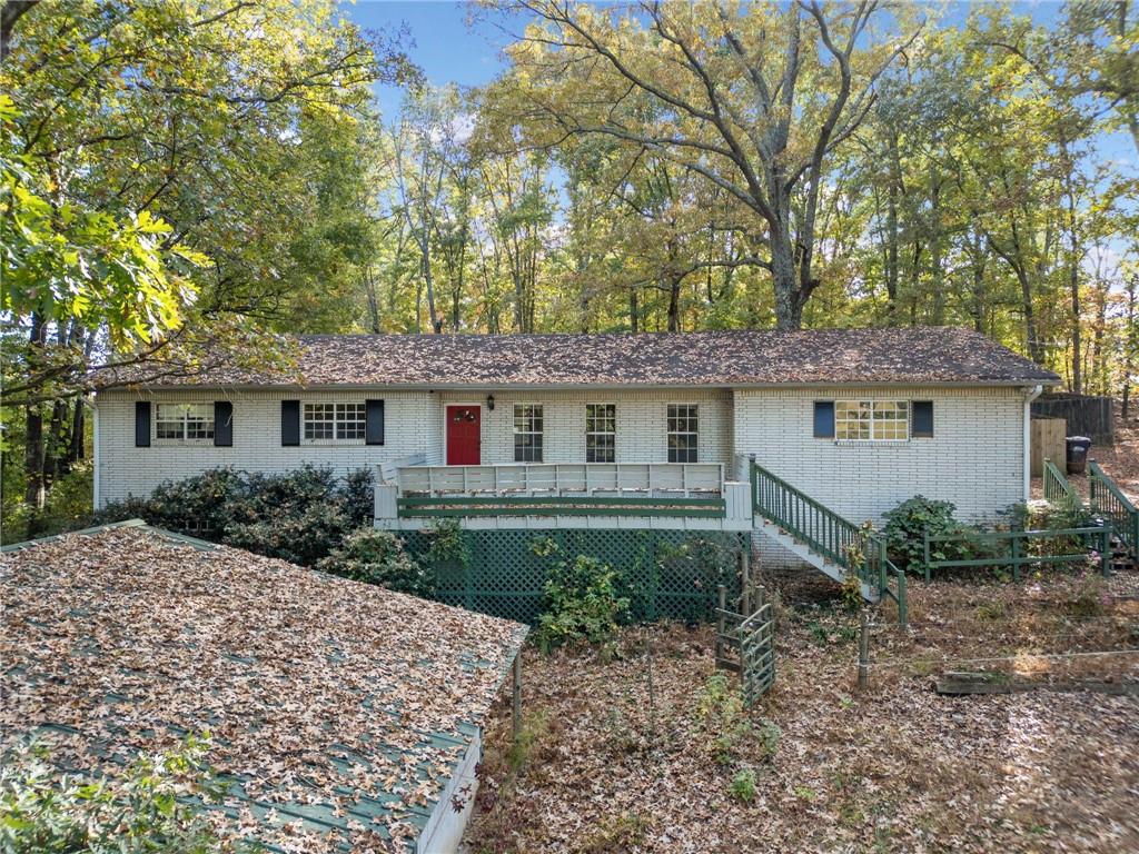 3636 Anneewakee Road Douglasville, GA 30135 - Photo 1 of 1 a front view of a house with garden