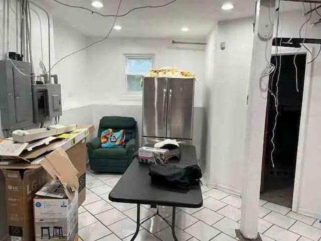 a hallway with table and chairs