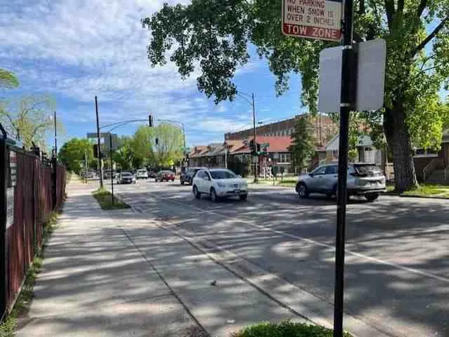 a view of a street with sitting area