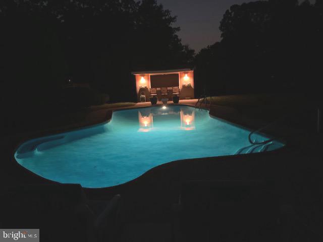 81 Plymouth Road Sicklerville, NJ 08081 - Photo 9 of 59 Nighttime pool lighting